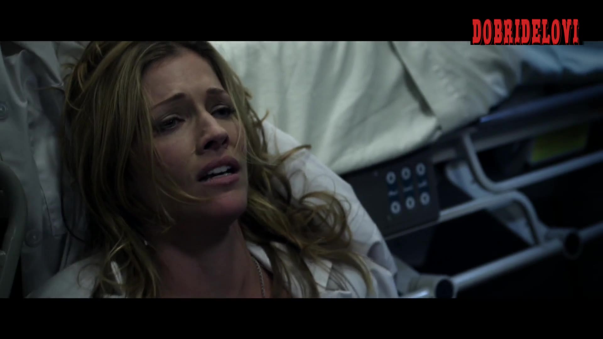 Tricia Helfer exposed in hospital bed scene from Bloodwork