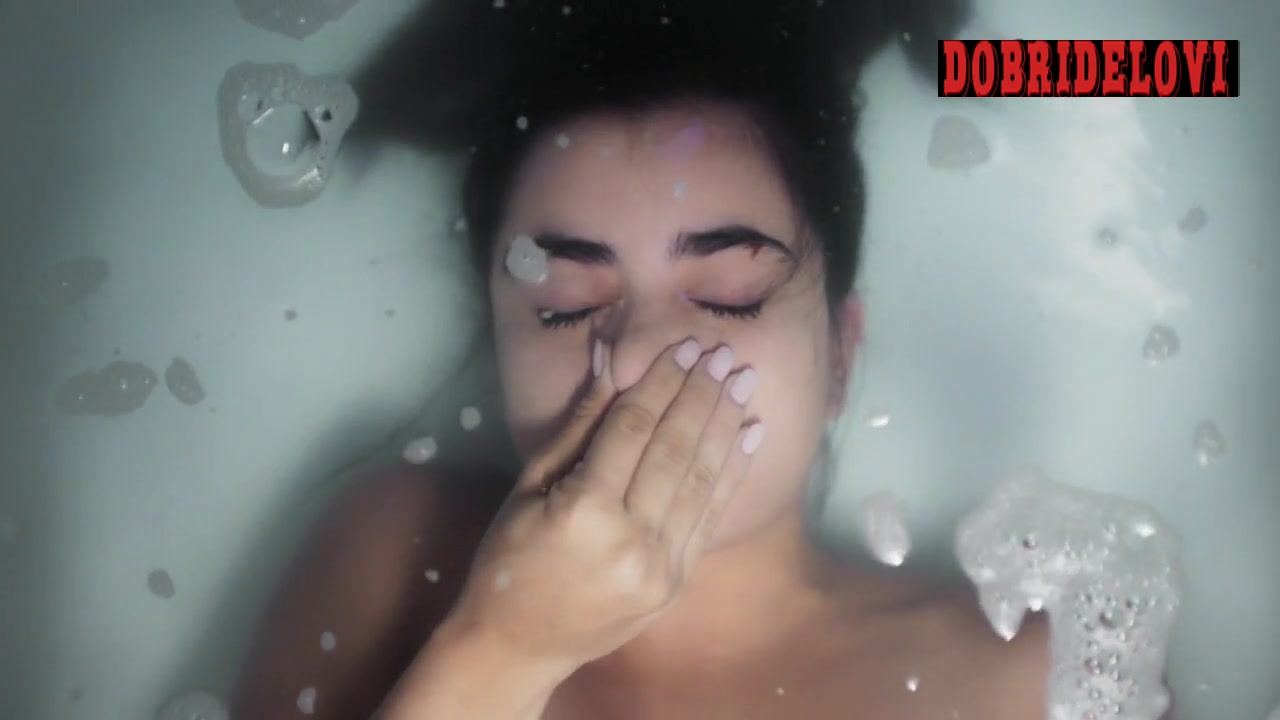 Paulina Gaitan holds breath in bathtub