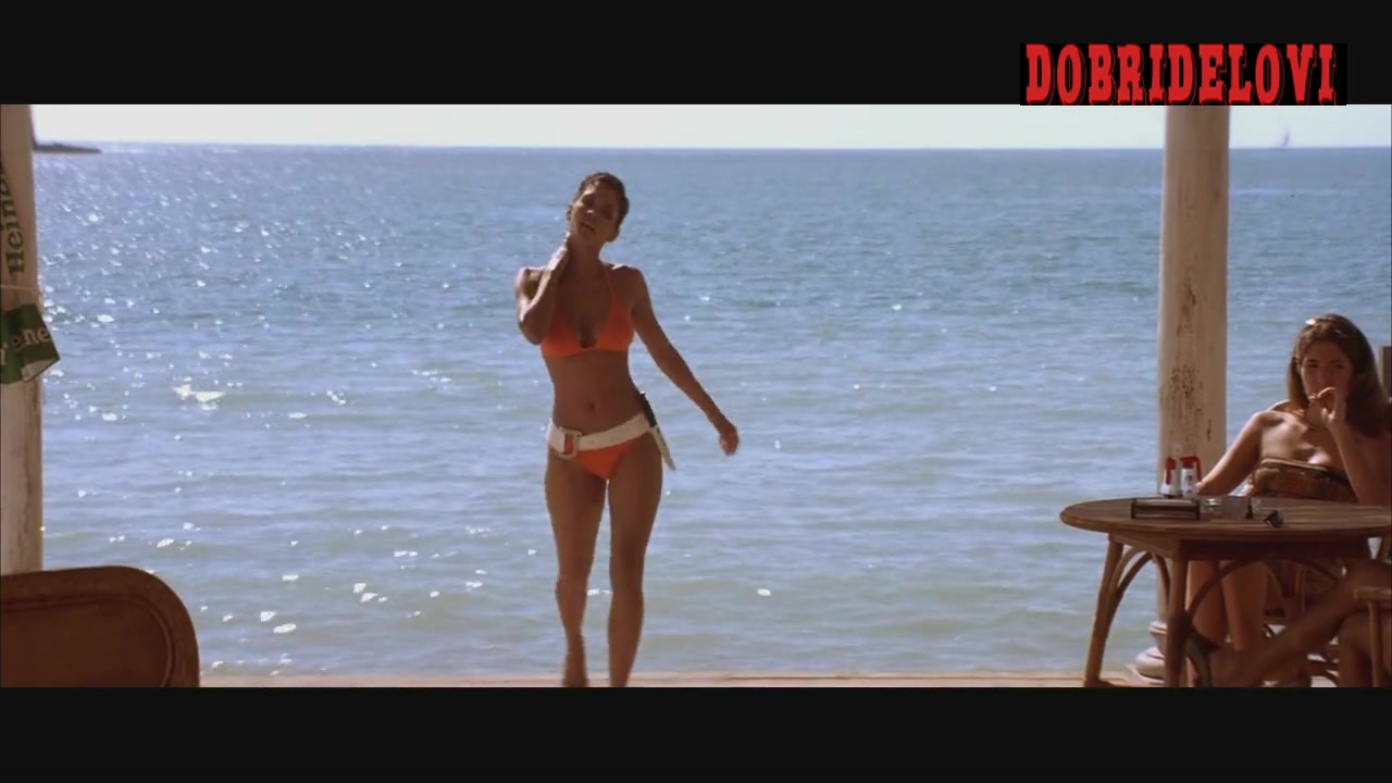 Halle Berry gets off the beach in orange bikini