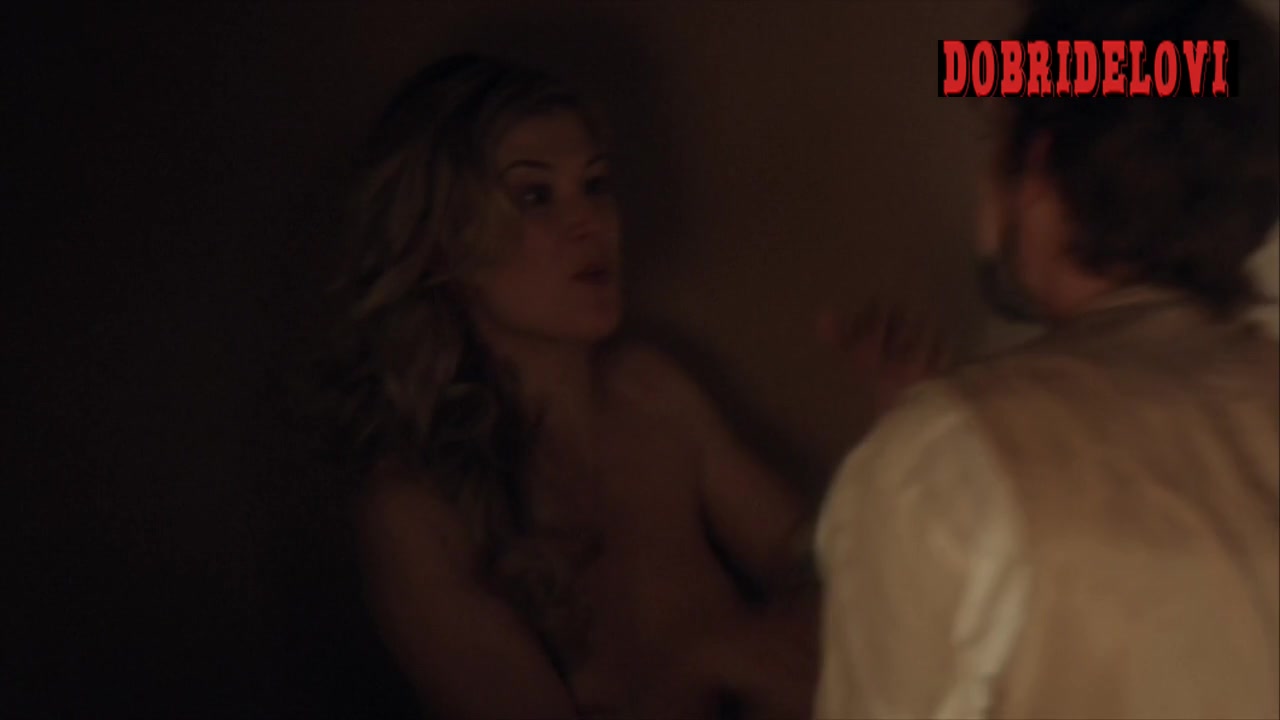 Rosamund Pike kisses dude with exposed breasts