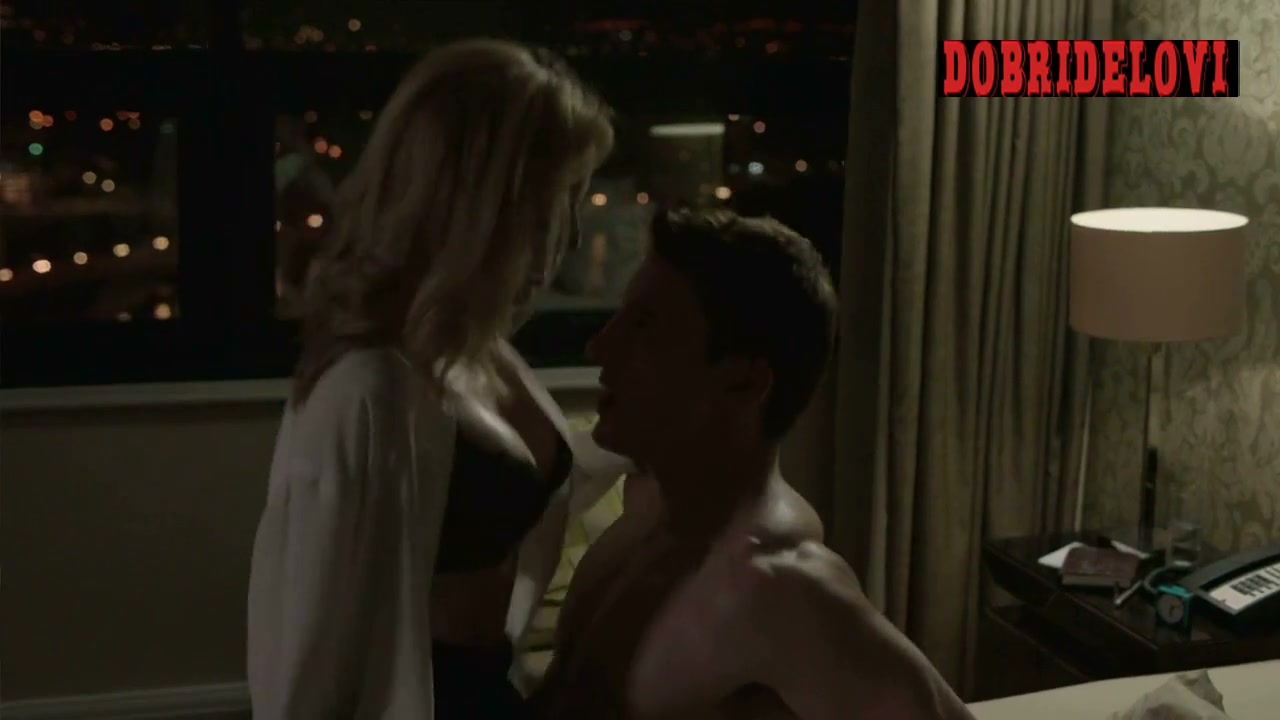 Gillian Anderson on top of man in bed scene from The Fall