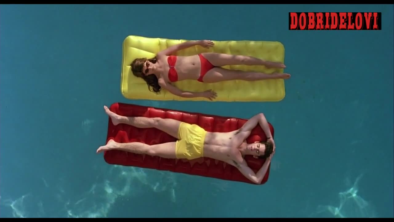 Lori Loughlin floating in pool scene from Secret Admirer