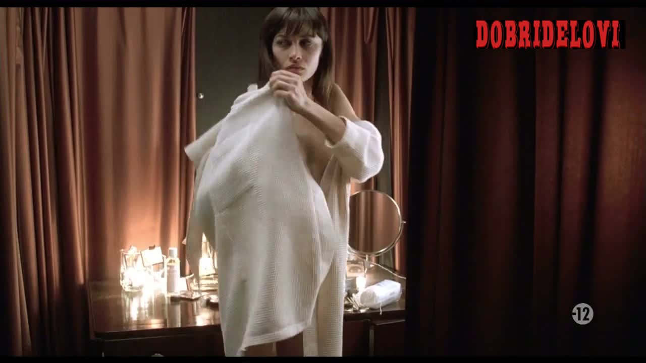 Olga Kurylenko shirt removed and exposed breasts scene from The Serpent