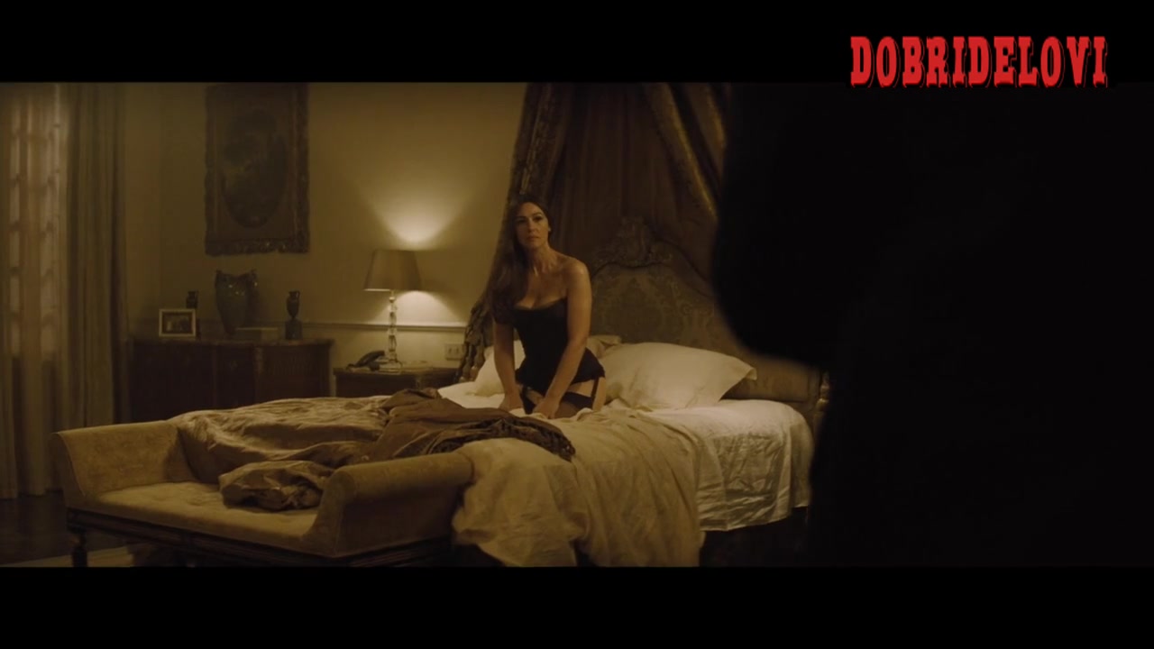 Monica Bellucci sitting in bed with black lingerie waiting for Bond -- Spectre