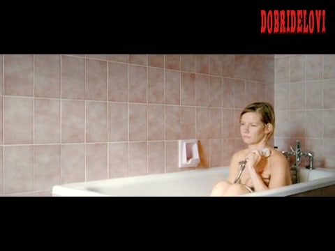 Sandra Hüller washing self in bathtub scene from Brownian Movement