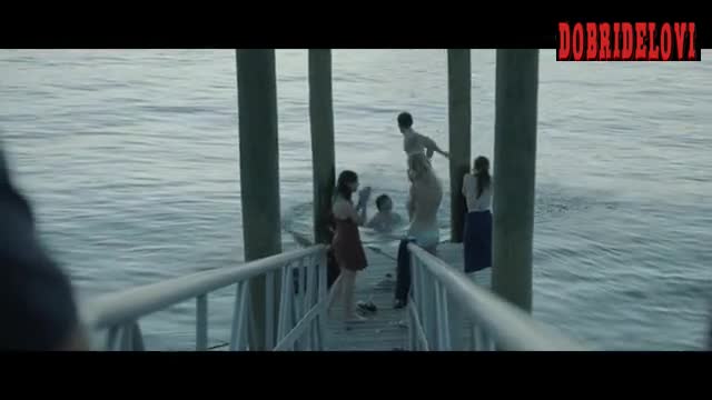 Mackenzie Davis jumping in water scene from Breathe In