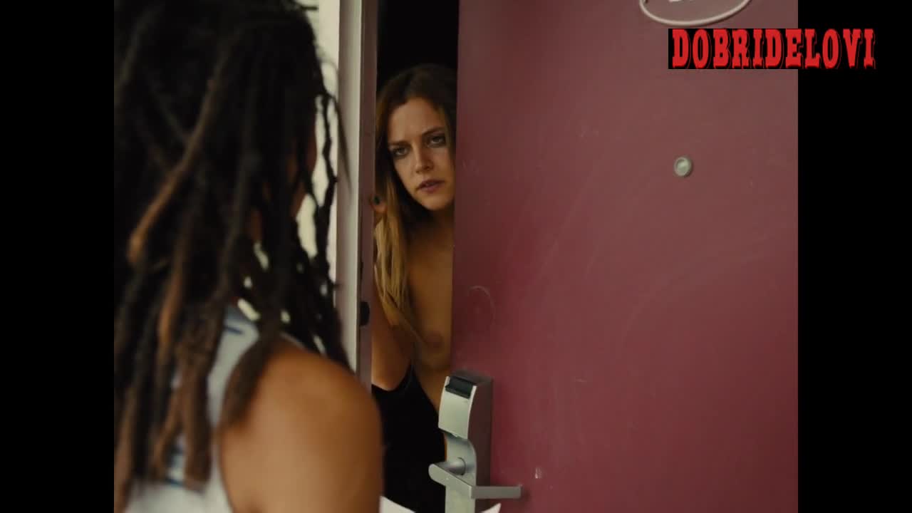 Riley Keough answering door while nude scene from American Honey