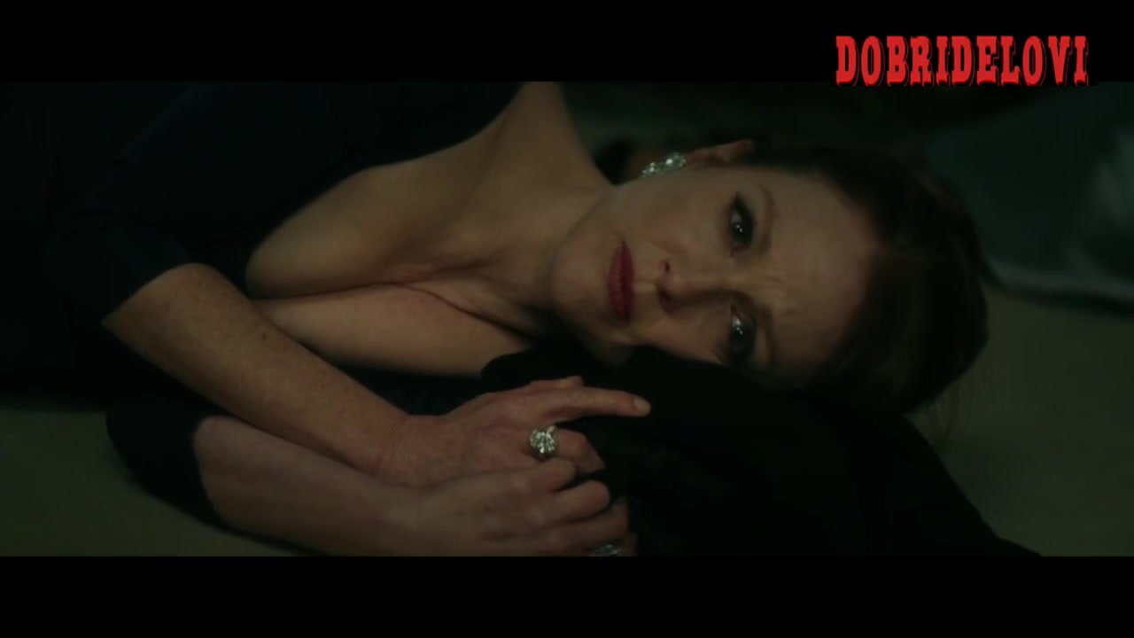Julianne Moore laying on the ground as hostage scene from Bel Canto