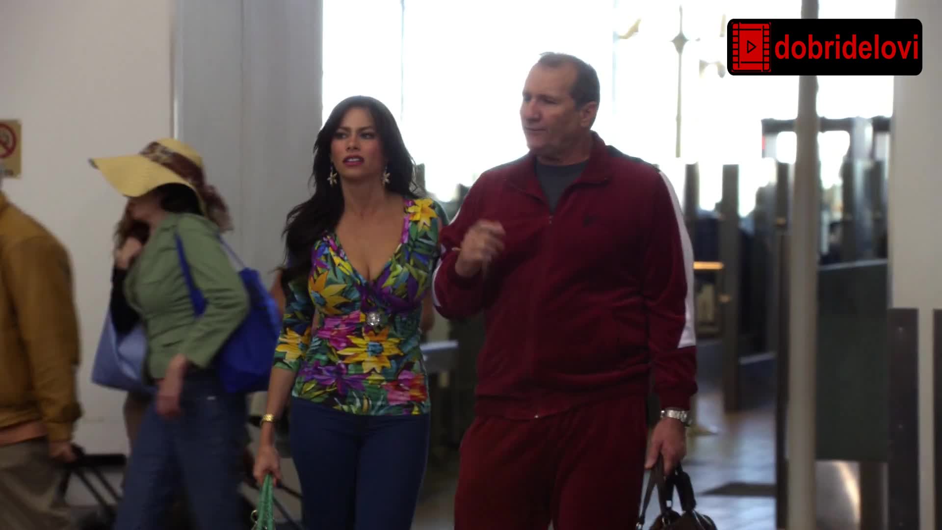 Watch Sofia Vergara airport cleavage  showcase scene from Modern Family video